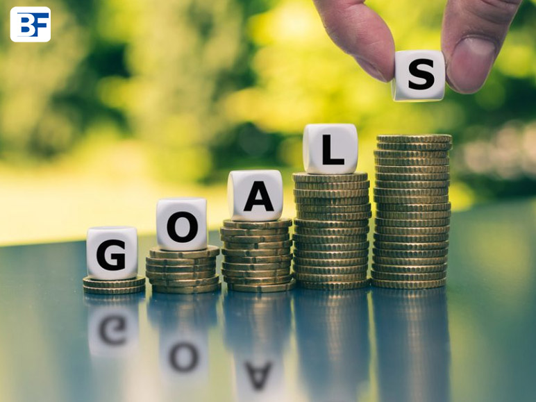 What is a way to stay accountable to reaching your financial goals_