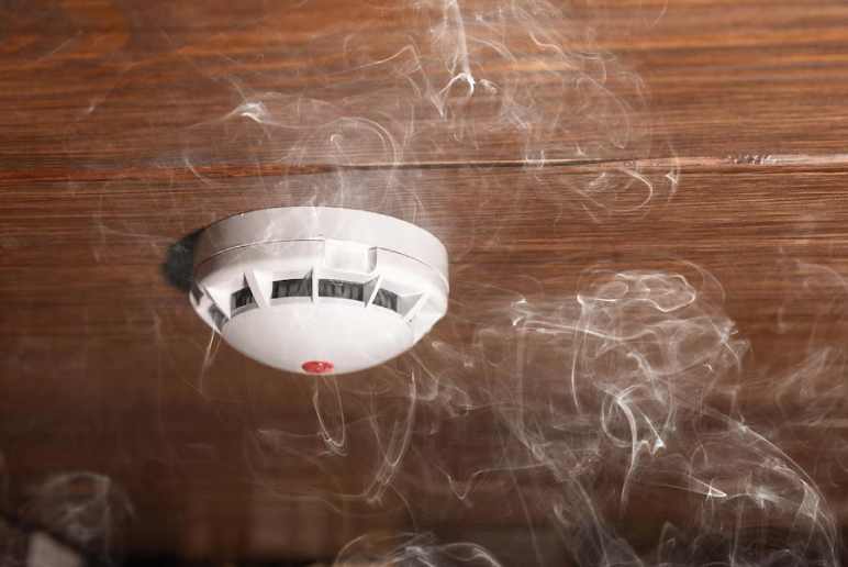  how do you stop a hardwired smoke detector from beeping
